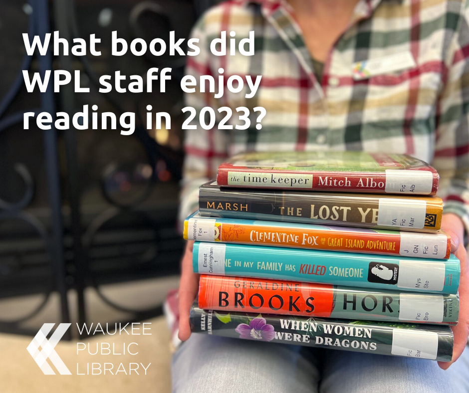 A person holds up a stack of books with the words "What books did WPL staff enjoy reading in 2023?" overlaying the photo